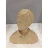 A STONE BUST OF A YOUNG BOY HEIGHT 18CM