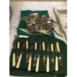 A LARGE QUANTITY OF VINTAGE FLATWARE INCLUDING KNIVES, FORKS, SPOONS, SERVING UTENSILS, ETC