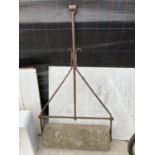 AN 18TH CENTURY STONE GARDEN ROLLER WITH CAST IRON HANDLE