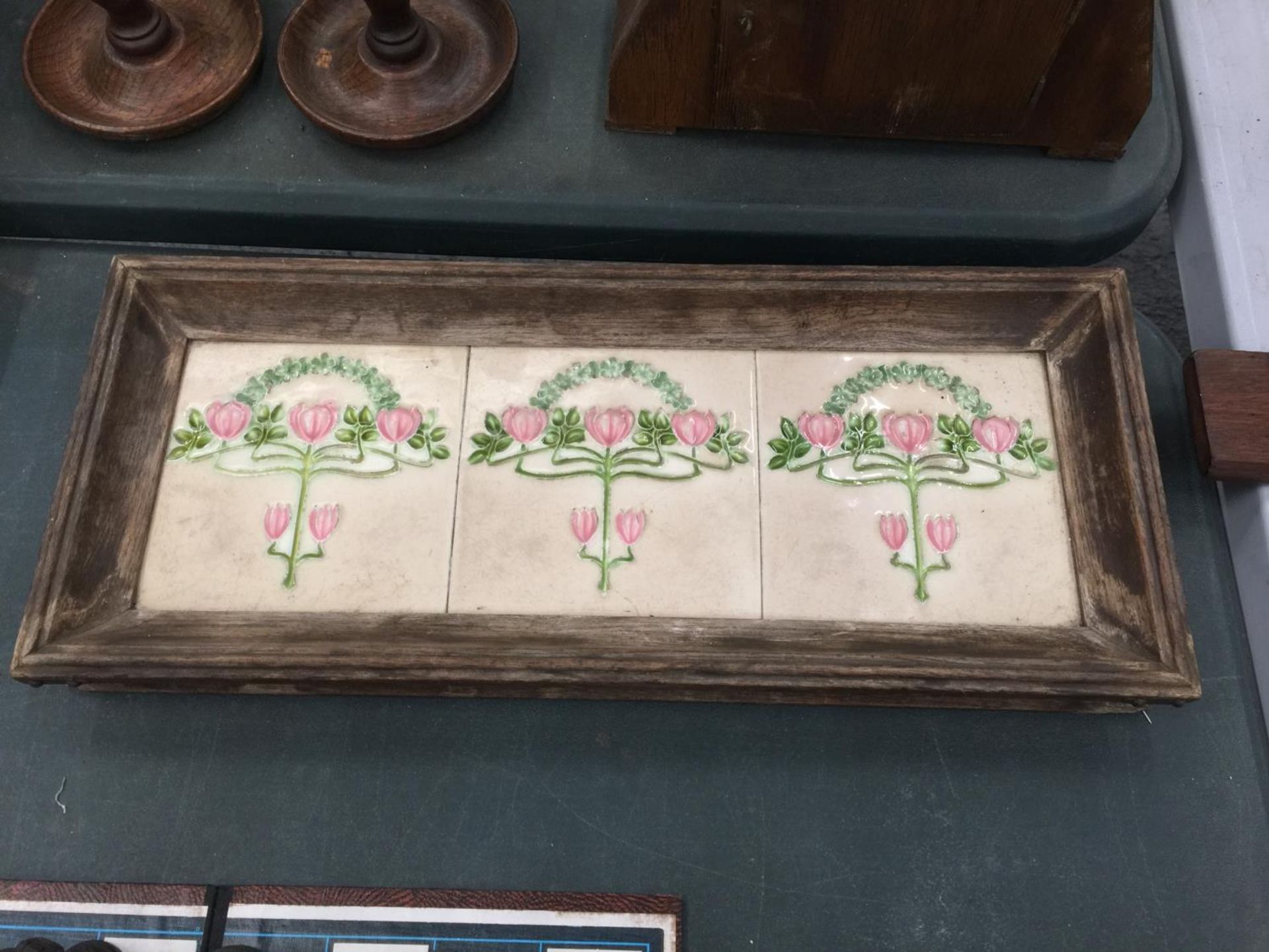 A SET OF THREE ART NOUVEAU STYLE MINTON TILES IN A WOODEN FRAME