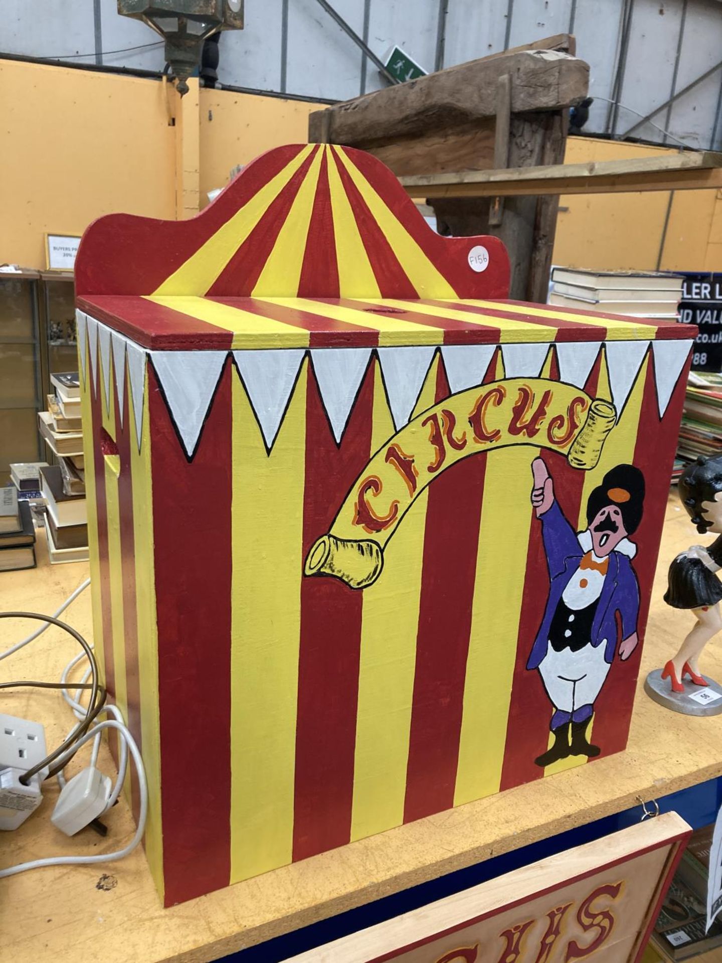 A WOODEN STORAGE BOX HAND PAINTED WITH A CIRCUS THEME HEIGHT 45CM WIDTH 50CM DEPTH 30CM