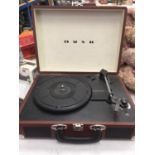 A BUSH CLASSIC TURNTABLE RECORD PALYER HOUSED IN A CASE