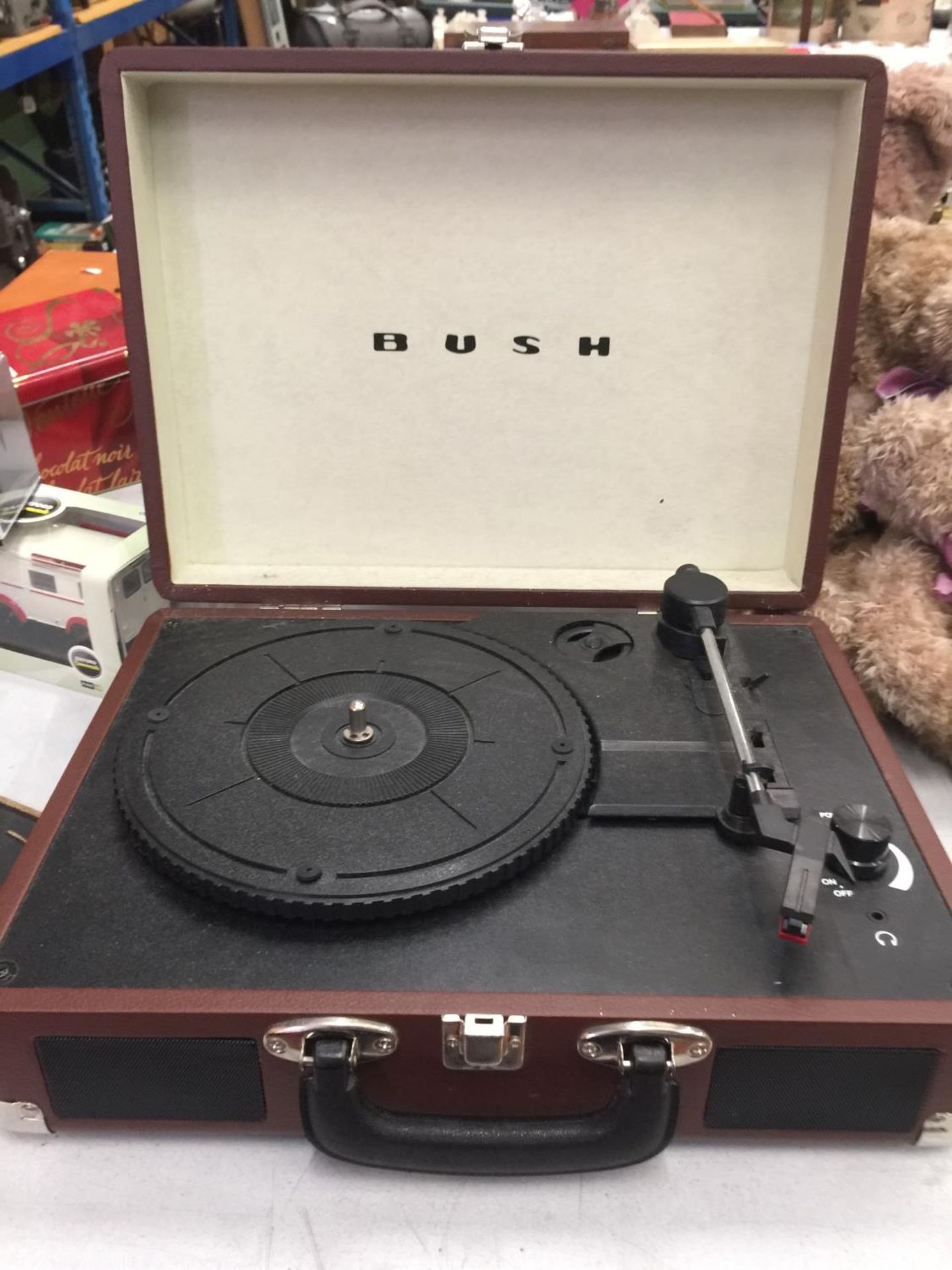 A BUSH CLASSIC TURNTABLE RECORD PALYER HOUSED IN A CASE