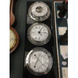 A WALL HANGING SET OF THREE BAROMETER, CLOCK AND THERMOMETER/HYGROMETER 37CM X 13CM