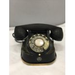 A VINTAGE BLACK WITH GILT DECORATION TELEPHONE FROM THE BELL TELEPHONE COMPANY