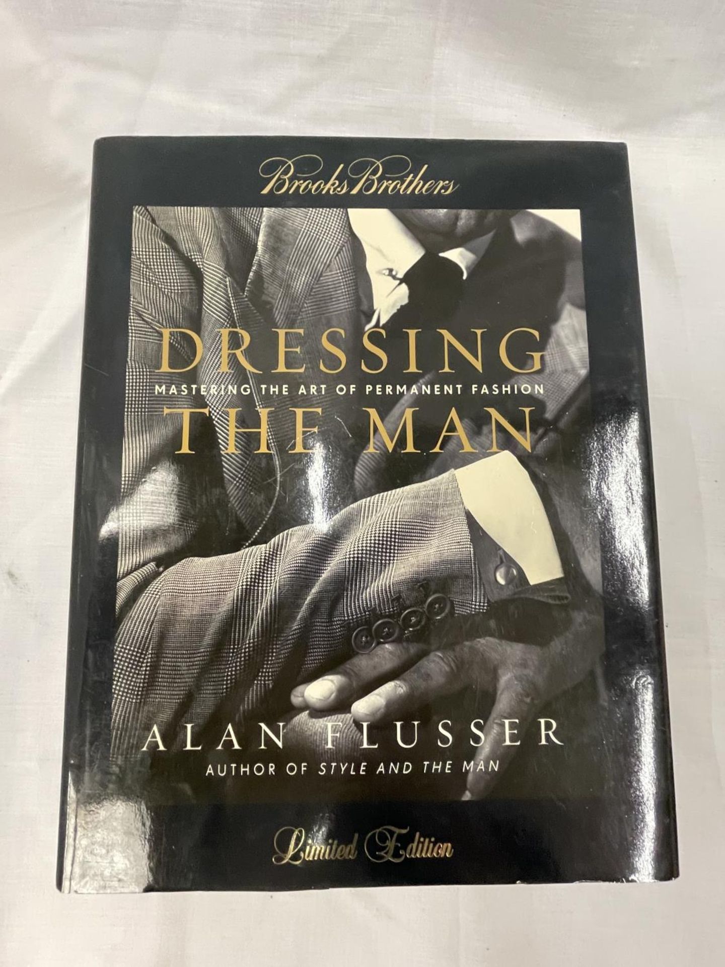 A FIRST EDITION DRESSING THE MAN BY ALAN FLUSSER