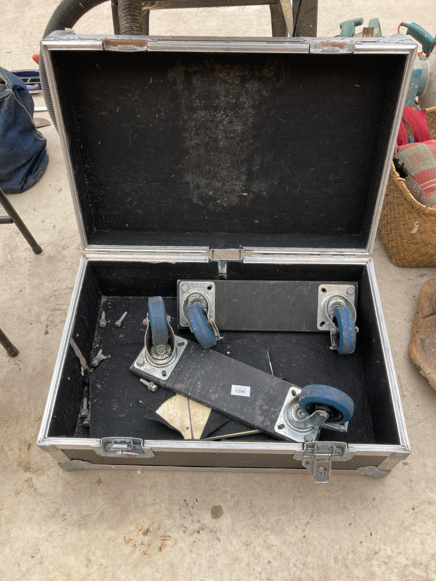 A HARD STORAGE CASE WITH FOUR WHEEL BASE