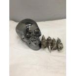 A CERAMIC SILVER COLOURED SKULL MONEY BOX AND FOUR JOINTED TALLON RINGS