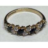 A 9 CARAT GOLD RING WITH FOUR SAPPHIRES AND EIGHT CUBIC ZIRCONIA SIZE M/N