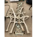 A PAIR OF VINTAGE CAST IRON BENCH ENDS AND FLORAL BENCH BACK