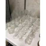 A QUANTITY OF GLASSES TO INCLUDE TUMBLERS, SHERRY, WINE, PORT, VASES, ETC