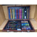 A WOODEN CASED ARTISTS SET