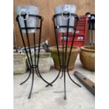 TWO WROUGHT IRON BUCKET STANDS WITH TWO ICE BUCKETS