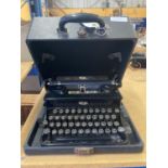 A VINTAGE ROYAL TYPEWRITER IN A CARRY CASE