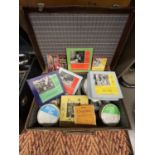 A CASE CONTAINING AN ASSORTMENT OF FILM REELS TO INCLUDE HUNCHBACK OF NOTRE DAME, CHARLIE CHAPLIN IN