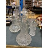 A QUANTITY OF GLASSWARE TO INCLUDE DECANTER, JUGS, VASES, ETC - ALL LARGE PIECES