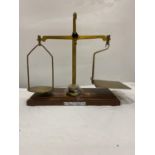 A SET OF POST OFFICE 'ARNOLD PRECISION SCALES' WITH WEIGHTS ON A MAHOGANY BASE