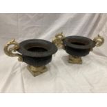 A PAIR OF CAST IRON URNS HEIGHT 21CM WIDTH 40CM