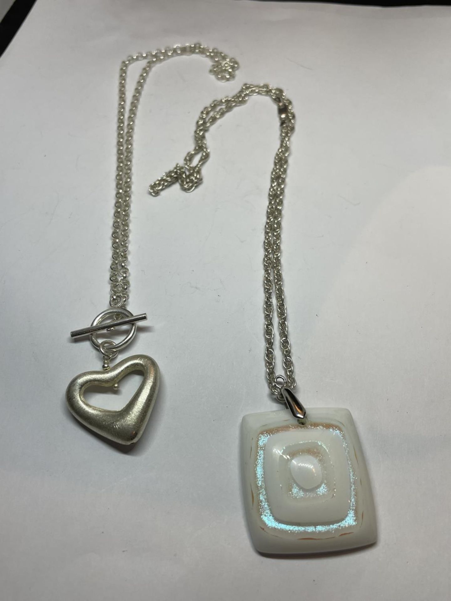 TWO MARKED SILVER NECKLACES WITH PENDANTS