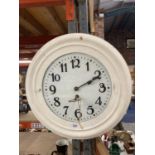 A VINTAGE WOODEN CASED WALL CLOCK PAINTED WHITE COMPLETE WITH KEY