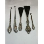 FIVE HALLMARKED SILVER HANDLED ITEMS TO INCLUDE BUTTON HOOKS AND SHOE HORNS