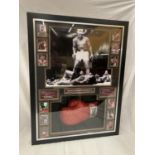 A FRAMED AND SIGNED MUHAMMAD ALI BOXING GLOVE WITH PHOTOGRAPHS, QUOTES AND HISTORY CERTIFICATE OF