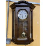 A MAHOGANY CASED WALL CLOCK WITH GLASS PANELS HEIGHT 68CM