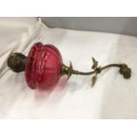 A CRANBERRY GLASS WALL OIL LAMP