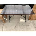 A PUB TABLE ON CAST IRON BASE, 47"X26"