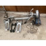 A PETROL ENGINE OUTBOARD MOTOR AND THREE OUT BOARD MOTOR CLAMPS