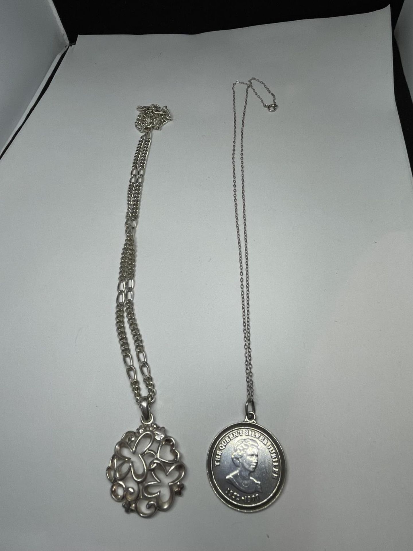 TWO MARKED SILVER NECKLACES WITH PENDANTS