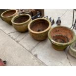 FOUR LARGE ASSORTED TERRACOTTA PLANTERS