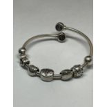 A MARKED SILVER CHAMILIA BRACELET WITH SEVEN CHARMS