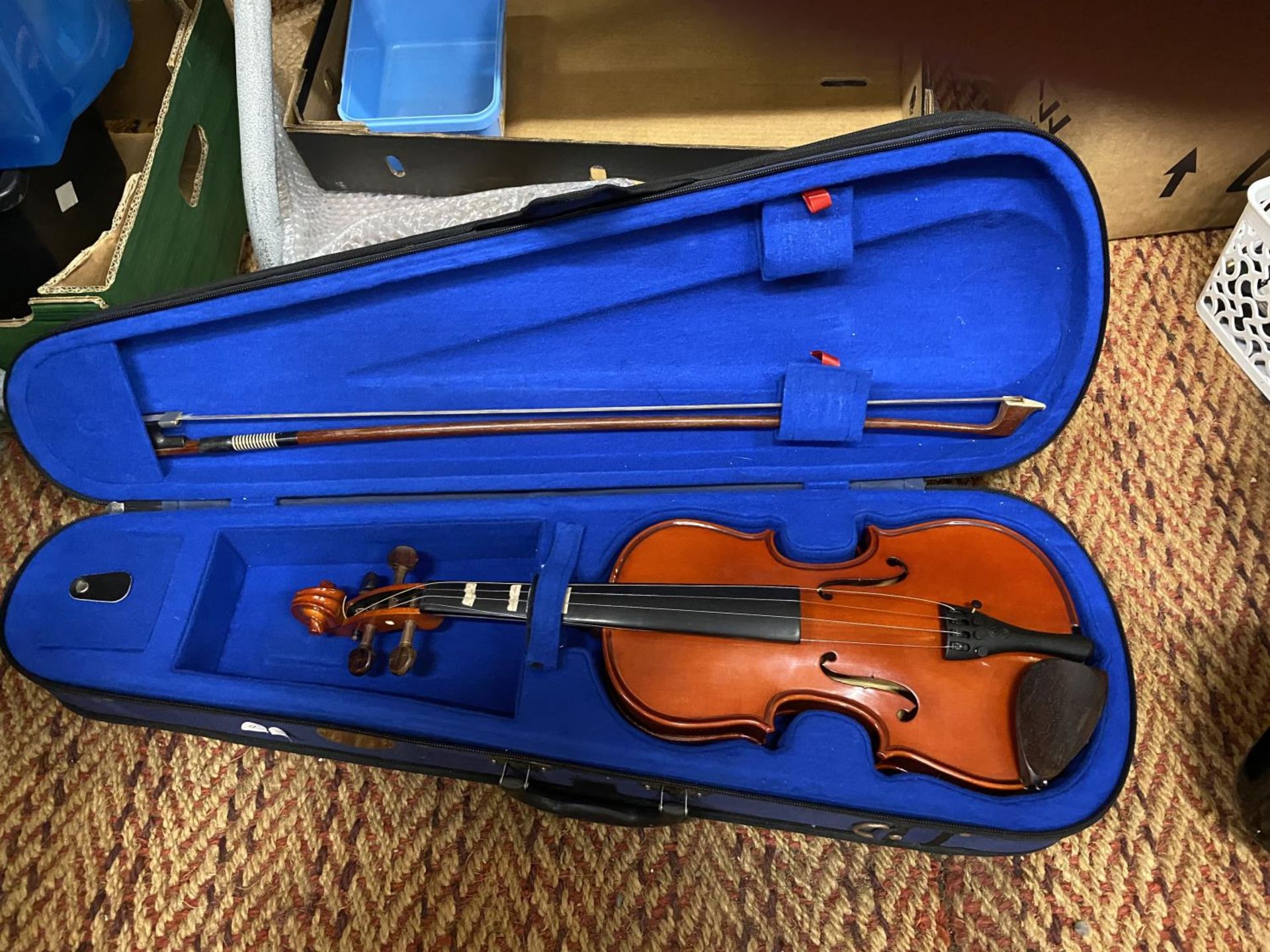 A CASED STENTOR VIOLIN AND BOW - NEEDS ATTENTION