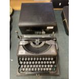 A RETRO IMPERIAL TYPEWRITER IN A HARD CASE
