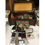 A MAHOGANY BOX CONTAINING A VARIETY OF COLLECTABLE ITEMS, A QUANTITY OF WATCHES TO INCLUDE AVIA,
