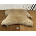 A SHEEPSKIN RUG