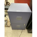 A TWO DRAWER METAL FILING CABINET
