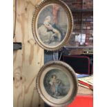 TWO OVAL GILT FRAMED PRINTS, ONE 'THE WOOD GATHERERS' THE OTHER A MAN AND WOMEN