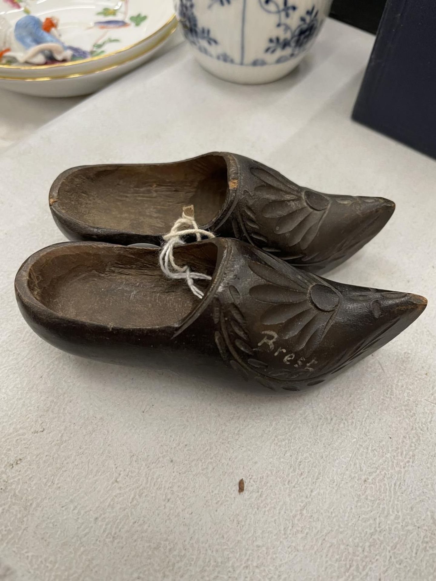 A PAIR OF MINIATURE WOODEN CLOGS WITH CARVED FRONTS - Image 2 of 2