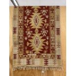 A FRINGED RUG