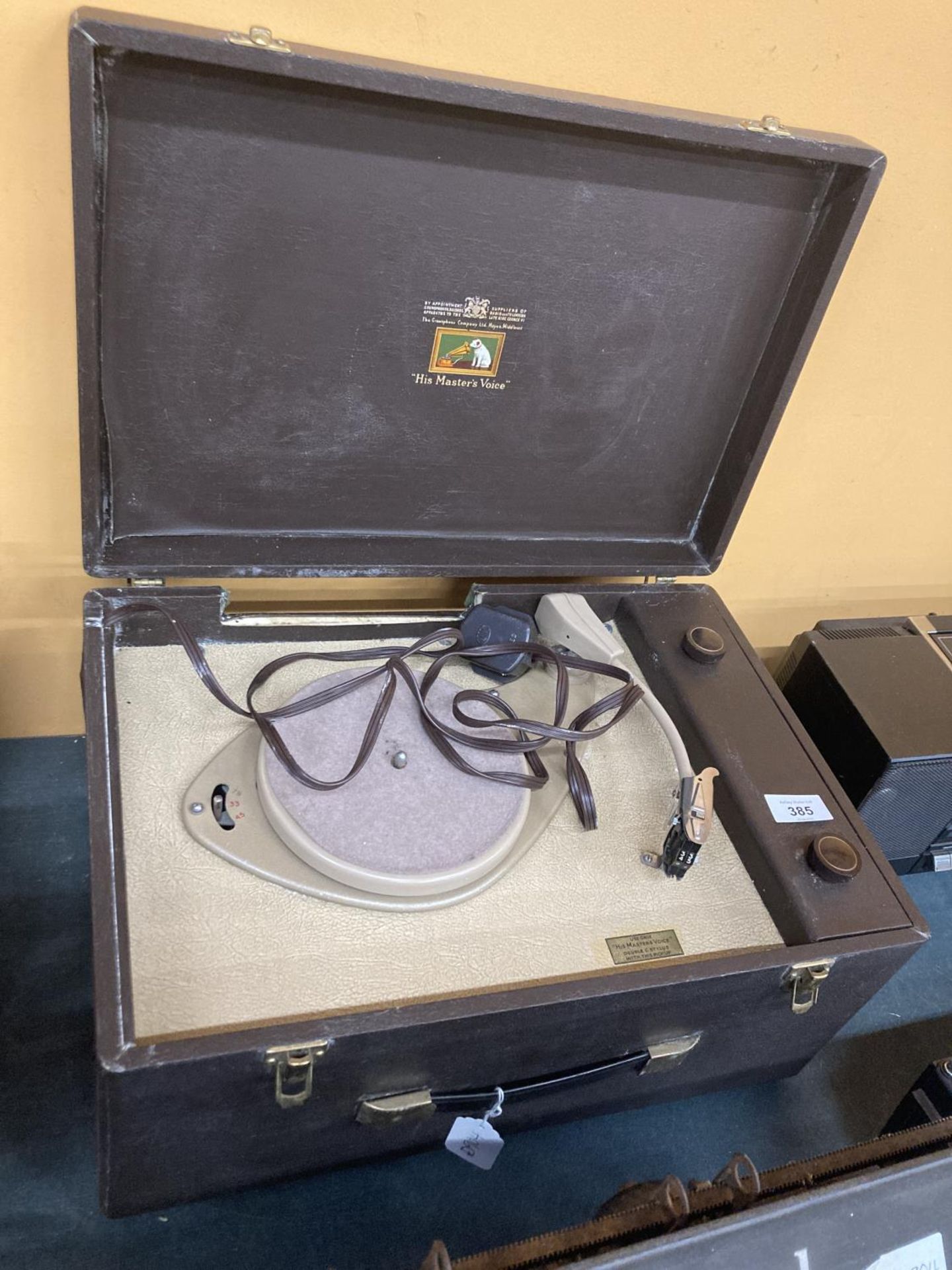 A HIS MASTER'S VOICE VINYL RECORD PLAYER IN A CARRY CASE