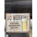 A TIN 'NO WORKING' SIGN