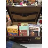 A BRIEFCASE CONTAINING A QUANTITY OF FICTION AND NON FICTION BOOKSTO INCLUDE HARRY POTTER, ROYAL