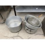 A QUANTITY OF CATERING SIZE SAUCEPANS AND COLANDERS