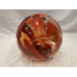 A LARGE STUDIO GLASS BALL APPROXIMATELY 26 CM DIAMETER