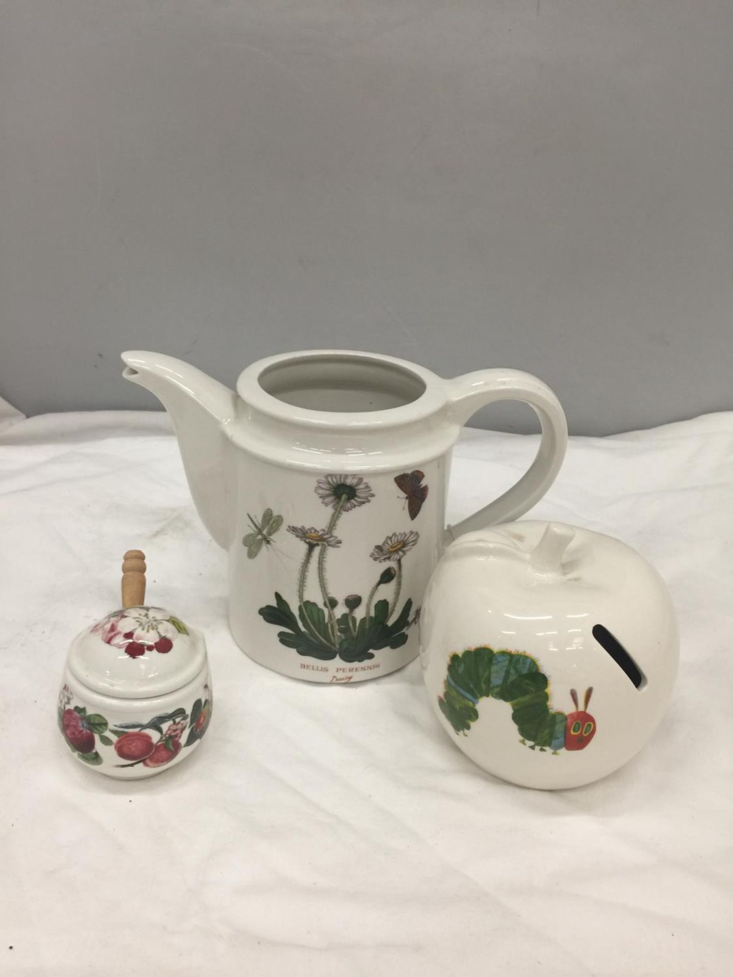THREE PIECES OF PORTMERION TO INCLUDE A TEAPOT-NO LID- A HUNGRY CATERPILLAR MONEY BOX AND A PRESERVE
