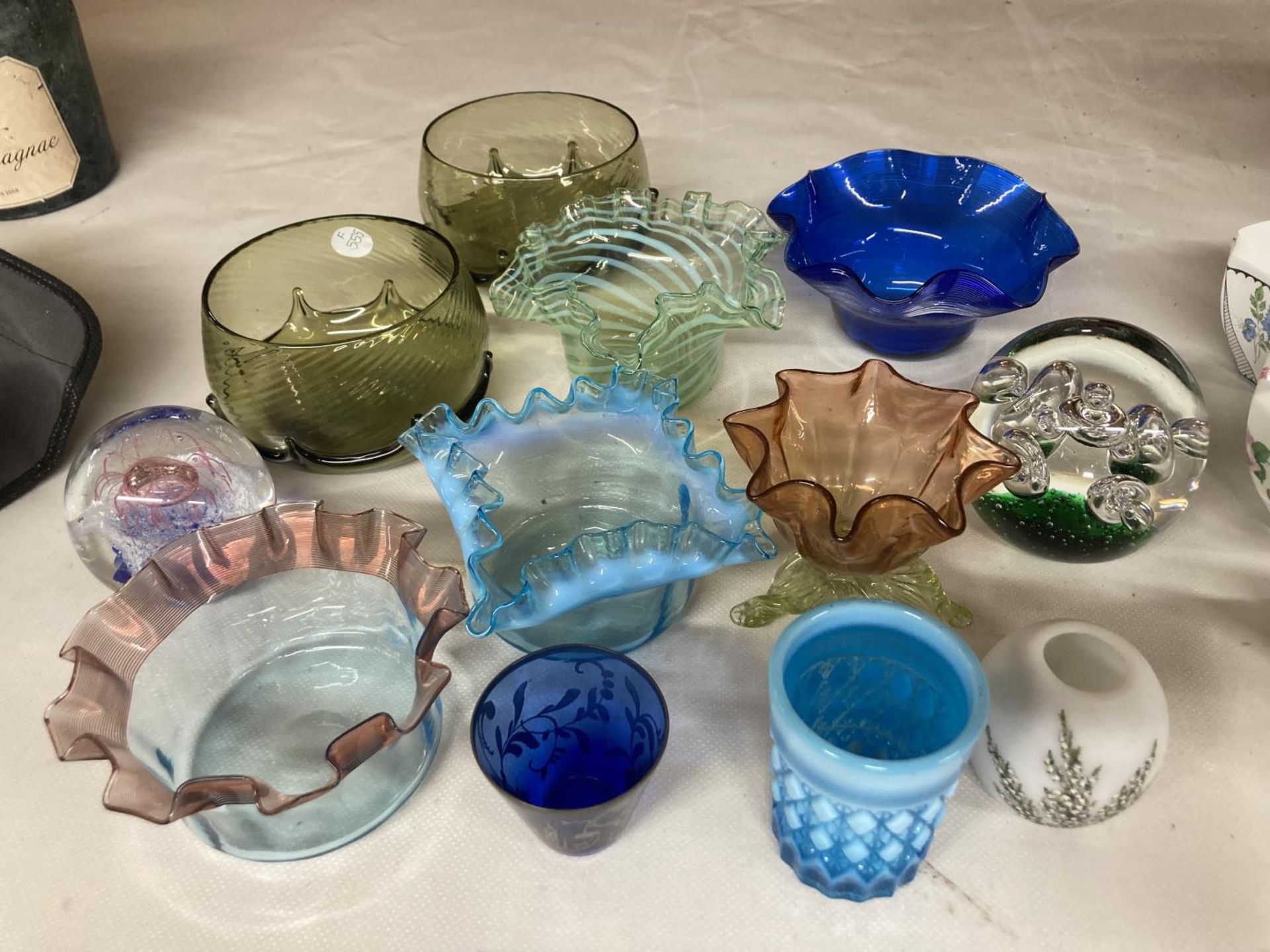 A QUANTITY OF COLOURED GLASS BOWLS PLUS PAPERWEIGHTS