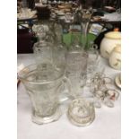 A QUANTITY OF GLASSWARE TO INCLUDE CUT GLASS ITEMS, DECANTERS, VASES, SHOT GLASSES, JUGS, ETC