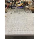 A LARGE QUANTITY OF GLASSES INCLUDING WINE, SHERRY, PORT, MARTINI, ETC